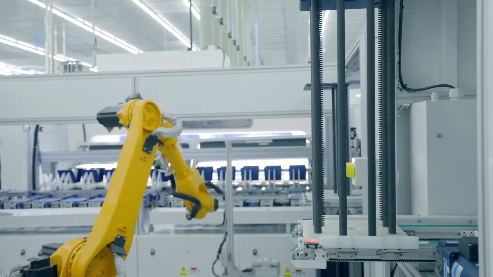 Industrial robotic arm in a high-tech production hall